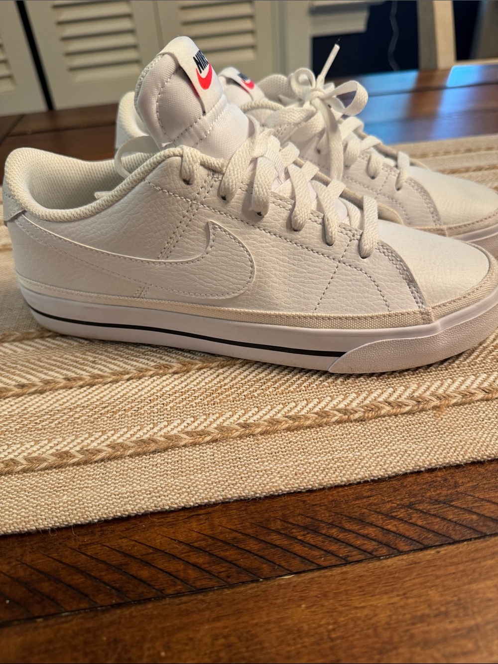 Nike White Low-Top Sneakers with Red Tongue Logo